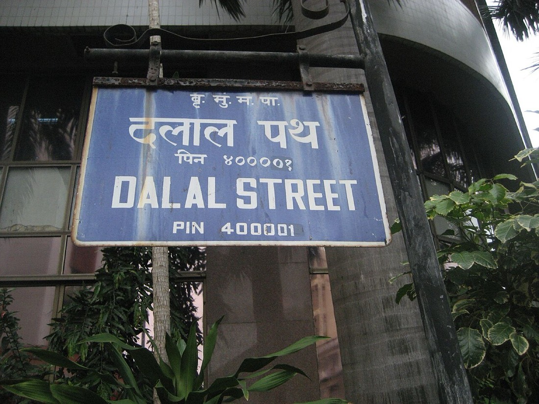 The Dalal Street sign in Mumbai, near where mutual fund trading desks execute the purchases later disclosed through SAST filings and monthly factsheets